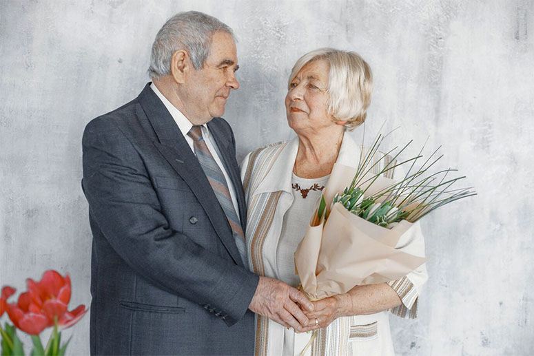 An old couple is getting ready for a wedding