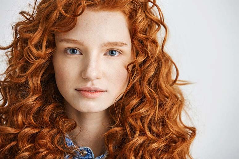 Portrait photo of a girl with red hair