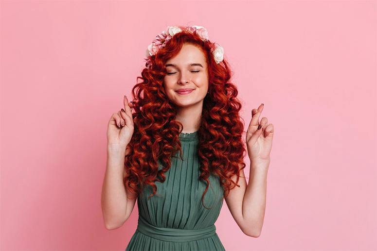 A woman with curly red hair