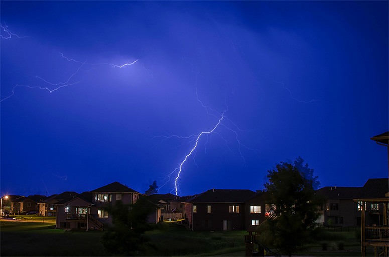 Many houses and a single lightning