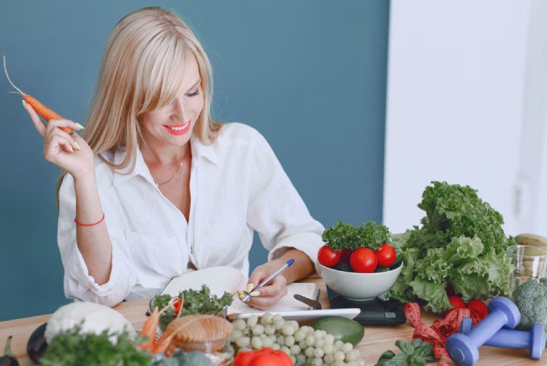 Blonde woman and table food of vegetable