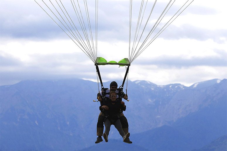 A couple is parachuting