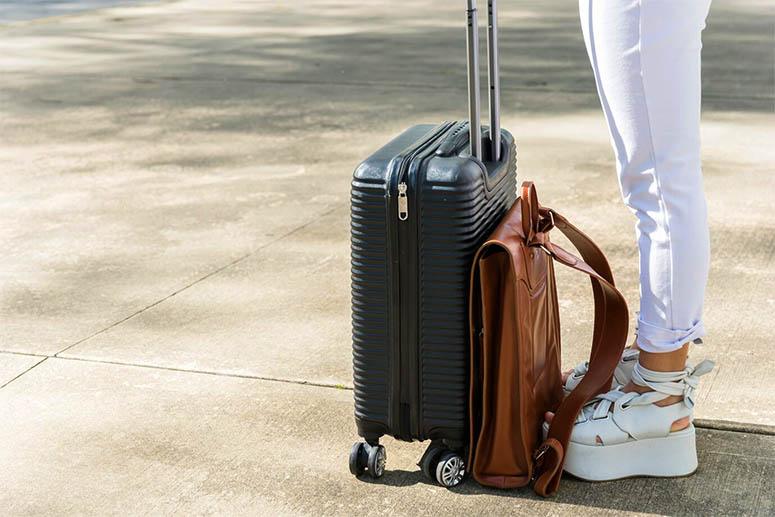 Female legs and suitcase 