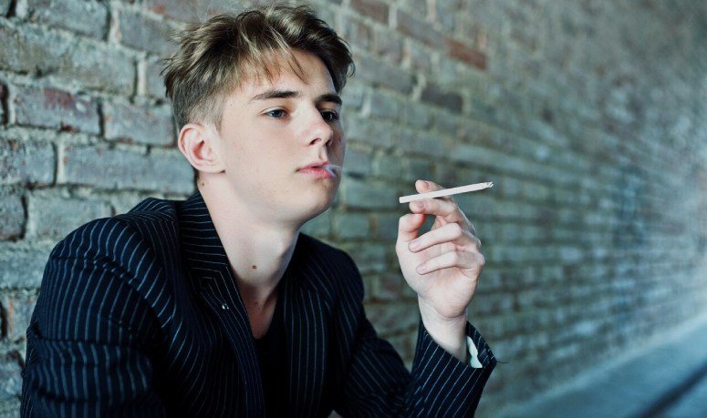 A boy smoking a cigarete