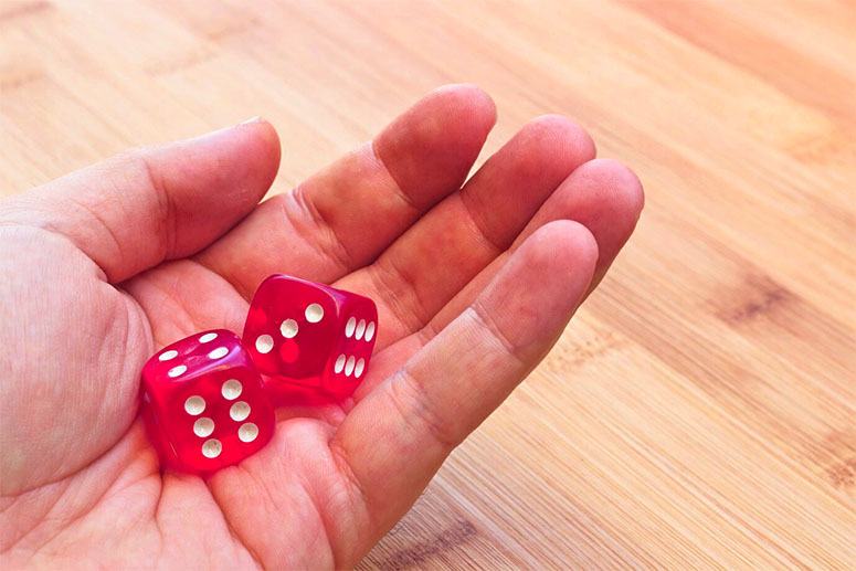 Hand holding a dices