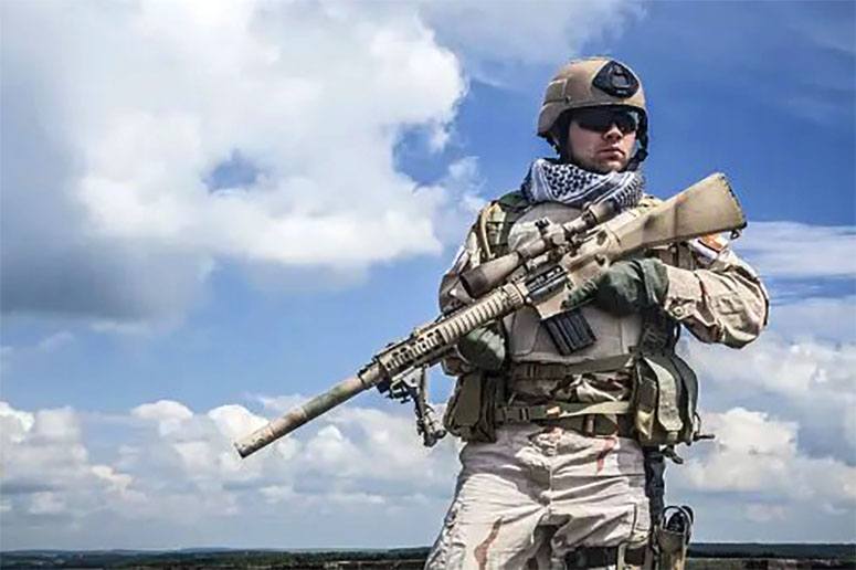 А Navy Seal with a machine gun