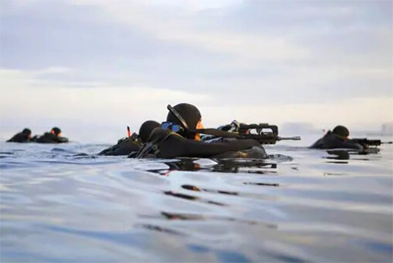 Navy Seals in the water preparing for operation