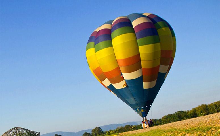 Colorful hot air balloon preparing to fly 