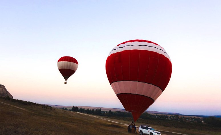 Two red hot air balloons 