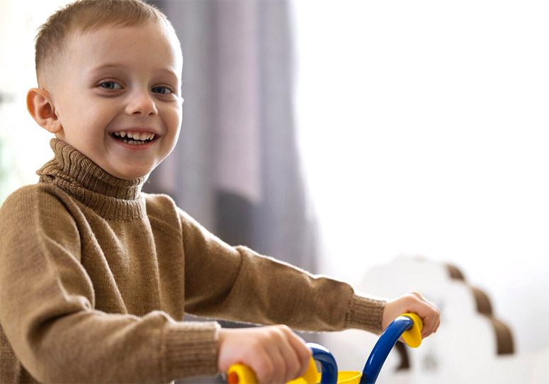 Smiling boy on a bike