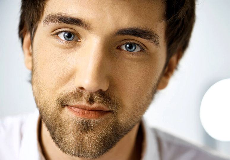 A man's face with blue eyes